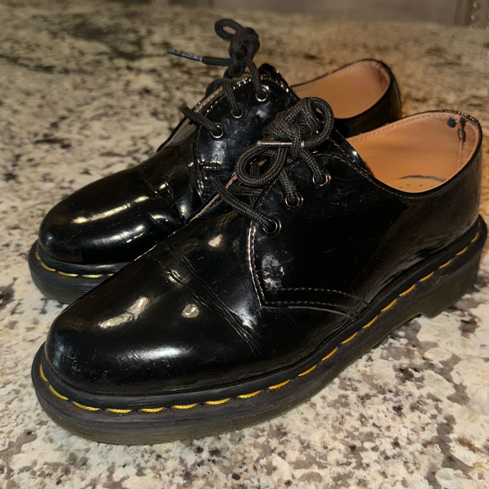 Woman’s black Dr. Martens patent leather shoe. Size 6